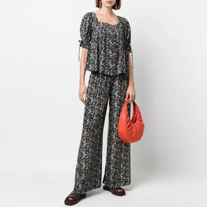 Elevate your wardrobe with the effortlessly stylish Ensemble Lorraine! Made with 100% silk, this ladies' suit features a square collar, short sleeves, and a fashionable print. The matching high waist wide leg trousers complete the look for a sophisticated and chic ensemble. Upgrade your style with the luxurious comfort of silk!