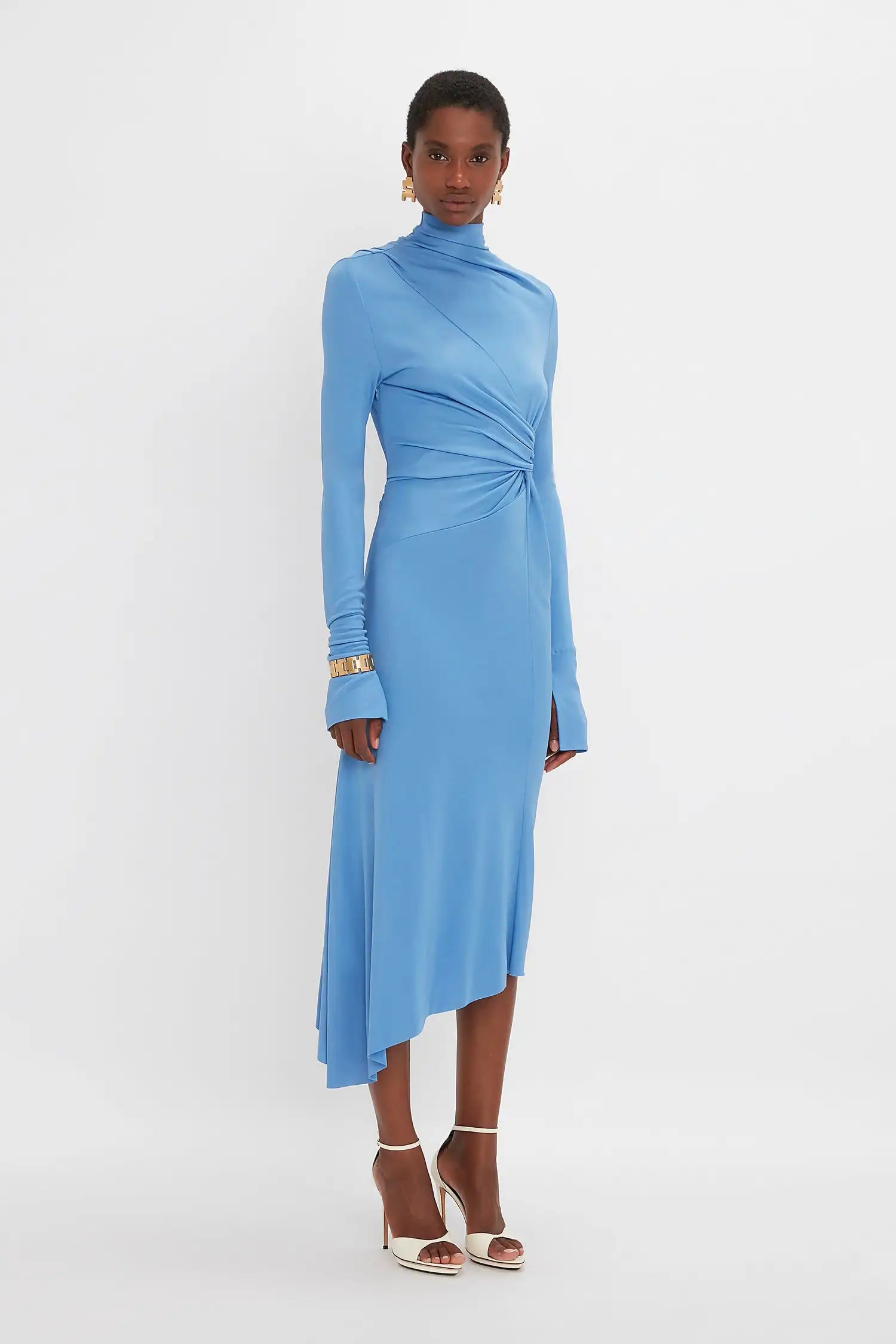 Experience luxury and sophistication with our Victoria Beckham asymmetric draped midi dress. Handmade by a high-end designer, this dress boasts a beautiful blue color and is crafted with the finest silk. Elevate your style with this stunning piece that exudes elegance and grace.