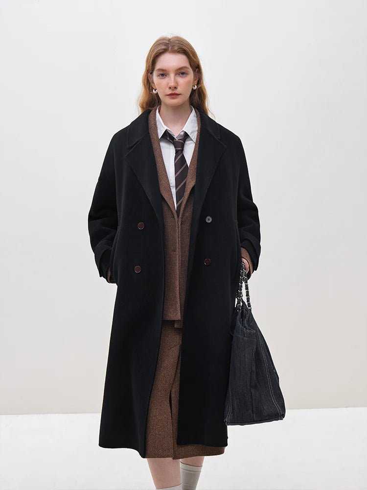 Introducing the Daneela Trench Coat, the epitome of winter elegance. Crafted from 100% wool, this long woolen jacket features a notched collar and double-breasted design, exuding sophistication and style. Complete with a flattering belt decoration, embrace your inner fashionista with this must-have piece.