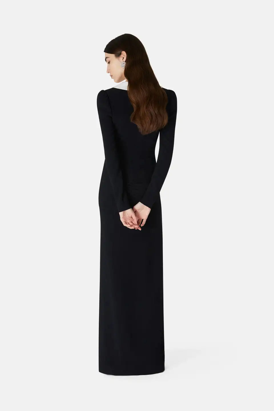 This Alessandra Rich maxi dress is crafted from stretchy viscose for a fluid feel and a fitted A-line silhouette. With a deep V-neckline, contrasting collar, and post-stud cuffs, it features a concealed zipper at the back. Adorned with tone-on-tone silk organza floral embellishments and broken details on the bodice, elevate your style with this elegant piece.