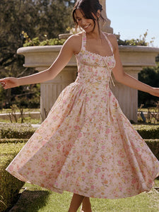 Adabella midi sundress is printed with colourful meadow flowers in full bloom that has us dreaming of Spring sunshine and balmy Summer days. Cut from a stretch cotton-rich fabric, it has a prettily gathered bustier neckline with wide self tie halter straps and a flattering fitted bodice. The voluminous midi skirt has a gorgeous floaty feel that's filled with soft tulle to hold the feminine shape beautifully. It zips to the back for easy on and is of course fully lined for comfort.