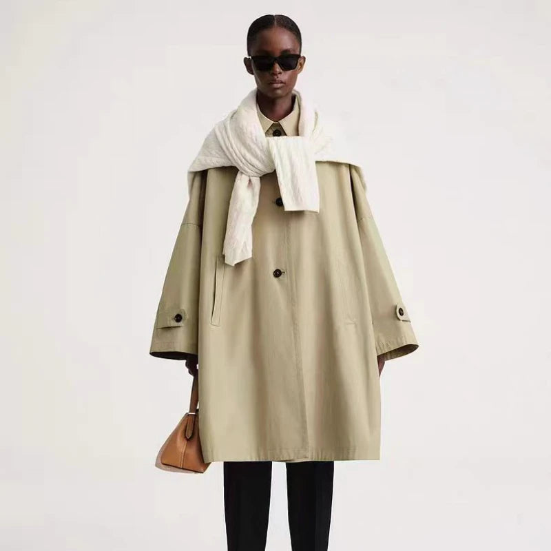 Elevate your spring style with the Trench-coat Elise. This early spring new arrival features an A-line design in a beautiful cashew color, perfect for any occasion. The removable lined interior keeps you warm and comfortable, while the toteme detailing adds a touch of elegance. Upgrade your wardrobe with this must-have piece.