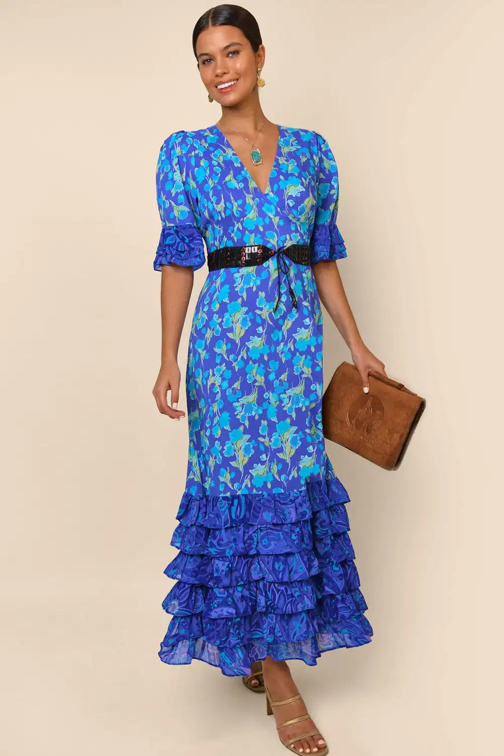 Indulge in the luxurious sophistication of the high-end designer Dress Blue Mari. Handmade with impeccable attention to detail, this long floral dress is perfect for any occasion. From casual shopping trips to elegant banquets, you'll look and feel stunning in the blue floral design. Elevate your wardrobe with this must-have piece.