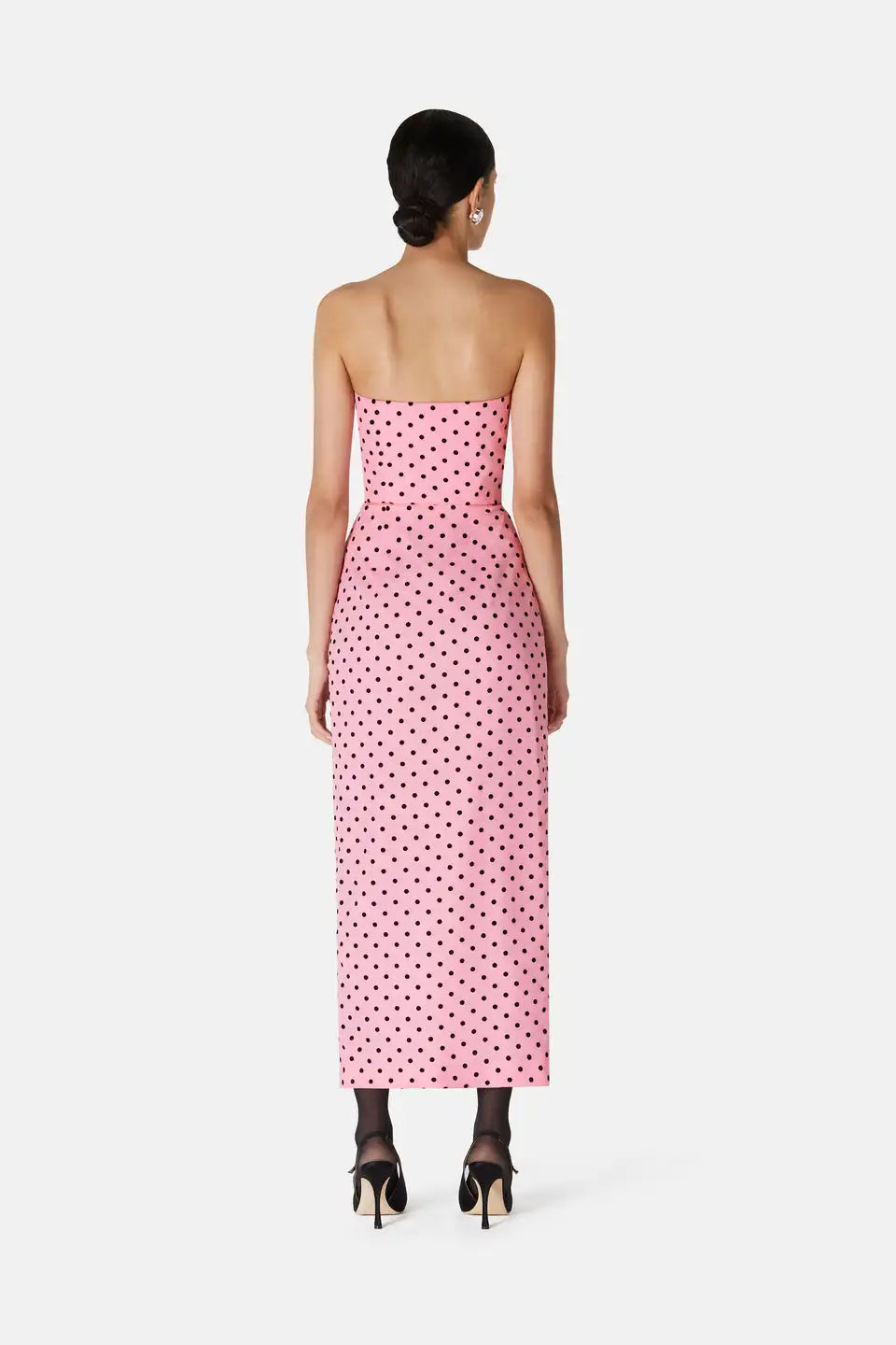 Introducing the Flocked Polka Dot Silk Georgette Dress by Alessandra Rich. Made with luxurious silk georgette fabric and adorned with delicate flocked polka dots, this dress exudes elegance and sophistication. Perfect for any special occasion, this dress is a must-have for any fashion-forward individual looking to make a statement.