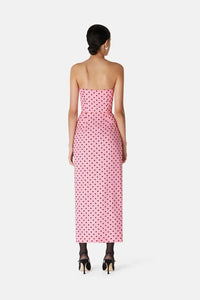 Introducing the Flocked Polka Dot Silk Georgette Dress by Alessandra Rich. Made with luxurious silk georgette fabric and adorned with delicate flocked polka dots, this dress exudes elegance and sophistication. Perfect for any special occasion, this dress is a must-have for any fashion-forward individual looking to make a statement.