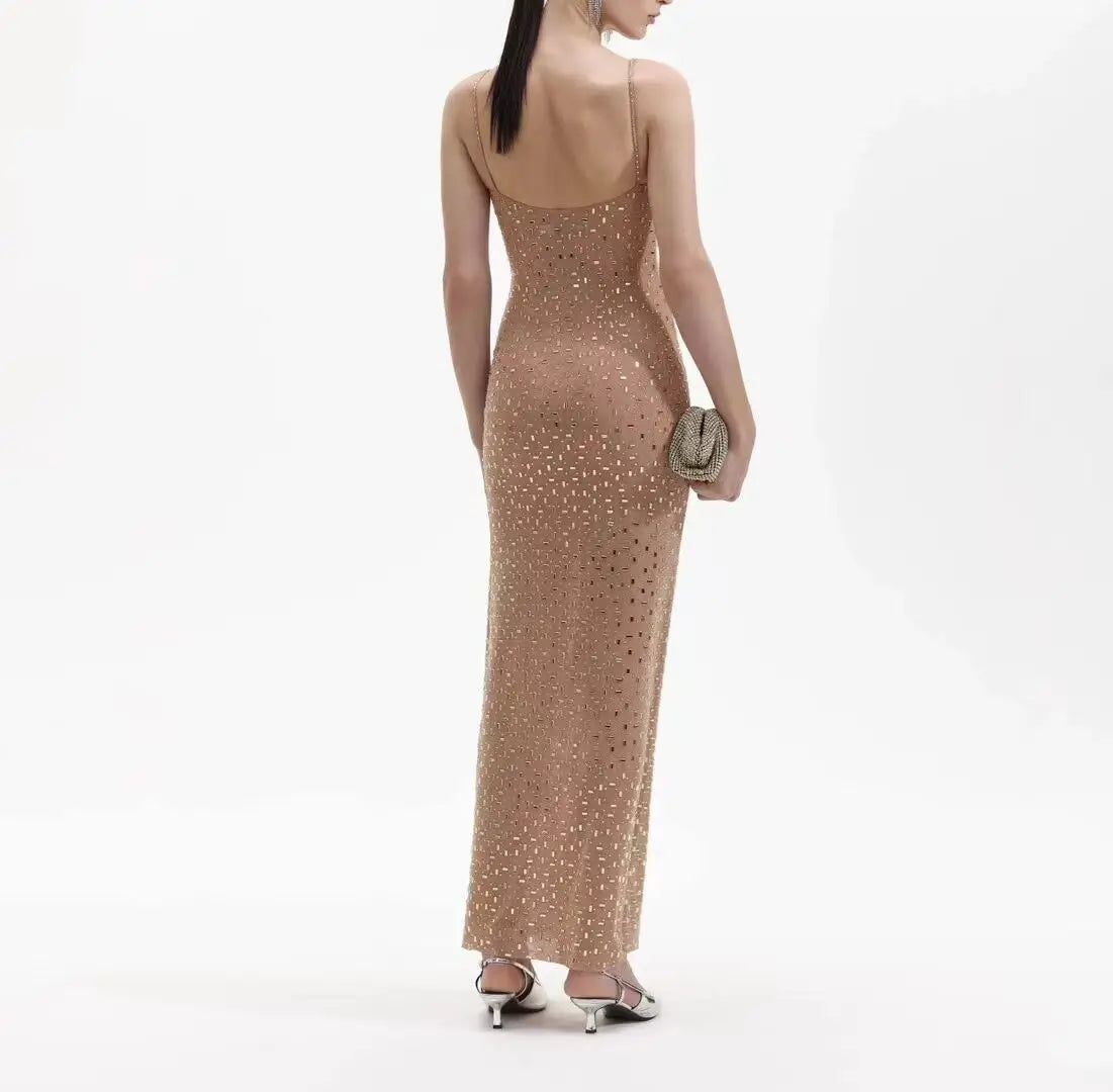 This stunning GOLD SQUARE RHINESTONE MESH MAXI DRESS features a sparkling mesh material adorned with intricate square rhinestones, making it the perfect dress for any glamorous occasion. Stand out while feeling luxurious and elegant in this exquisite and eye-catching dress.