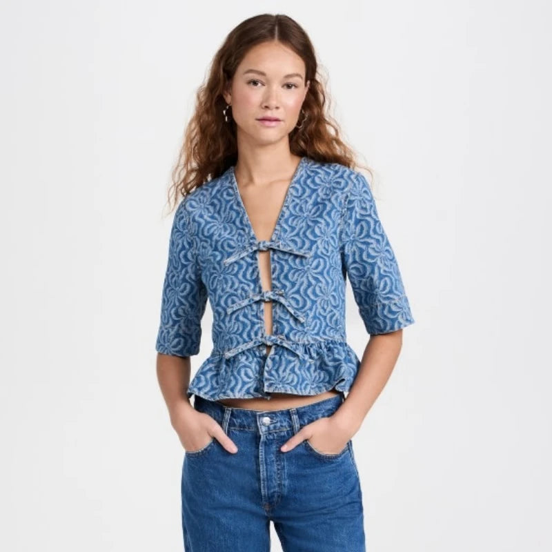 Elevate your wardrobe with Ganni's jacquard organic-cotton denim blouse. Made from premium, sustainable organic cotton, this blouse features a unique jacquard print that adds texture and style to any outfit. With a relaxed fit and casual vibe, this blouse is perfect for everyday wear.