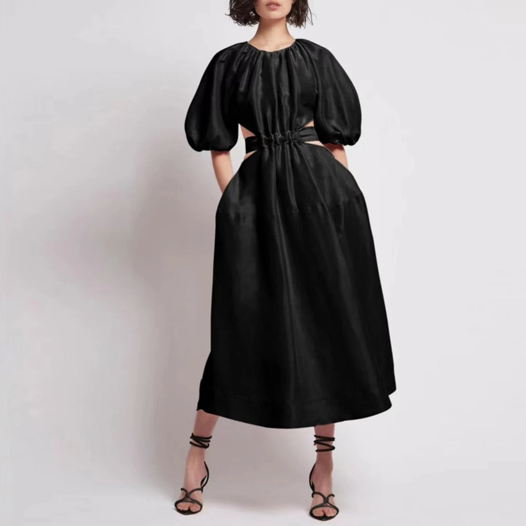 Elevate your style game with our new high waist, backless, puff sleeve midi dress from Aje. Designed with a sleek hollow pattern, this dress exudes sophistication and elegance. Perfect for any occasion, this dress will make you feel confident and chic all day long.