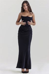 Dress Persephone is a stunning choice for any elegant occasion. With a strapless and bodycon design, this dress exudes confidence and sexiness. This black maxi dress is sure to make a statement and leave a lasting impression. Elevate your style with Persephone!