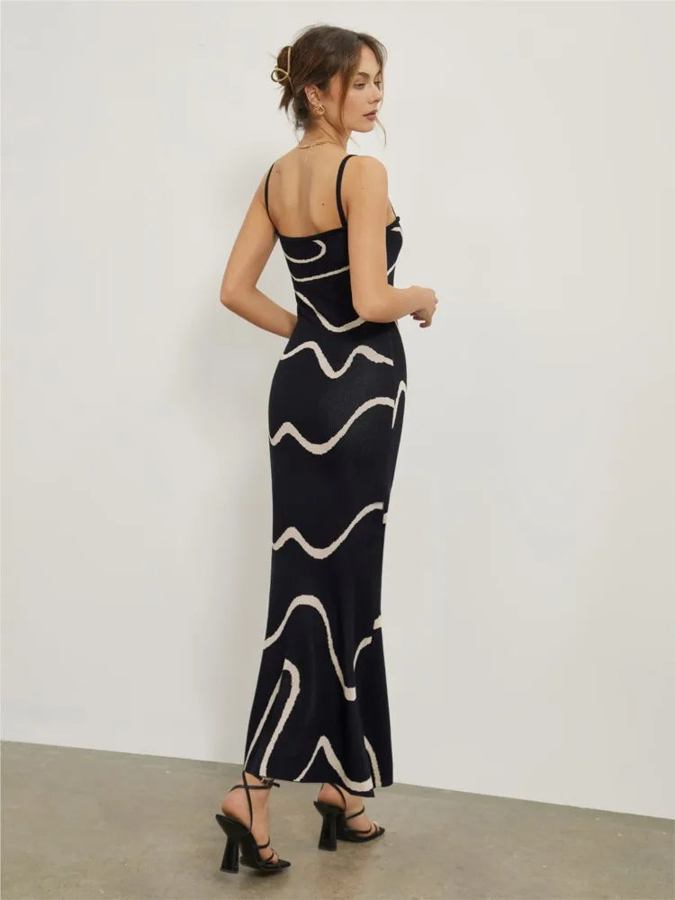 Achieve a bold and elegant look with our Dress Valentia. Featuring zebra stripes, a high waist design, and a backless cut, this knitted dress is perfect for any occasion. Its slim fit and long length will make you stand out at a street party or club gathering. Elevate your style with this versatile and chic maxi dress.