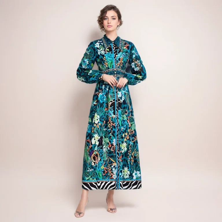 The Robe Nora is a trendy and elegant maxi dress, perfect for any occasion. Its soft green floral design adds a touch of femininity, while the turn down collar and long sleeves provide a sophisticated look. With the added feature of buttons, this dress is as functional as it is fashionable. Elevate your wardrobe with this versatile and stylish piece.