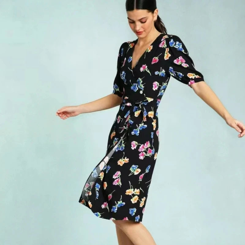 Be effortlessly stylish and chic with our Caitlin Dress! Perfect for the upcoming spring and summer seasons, this casual one piece wrap dress features a black bottom with a unique and eye-catching print. Elevate your wardrobe and turn heads with this must-have dress!