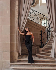Dress Persephone is a stunning choice for any elegant occasion. With a strapless and bodycon design, this dress exudes confidence and sexiness. This black maxi dress is sure to make a statement and leave a lasting impression. Elevate your style with Persephone!