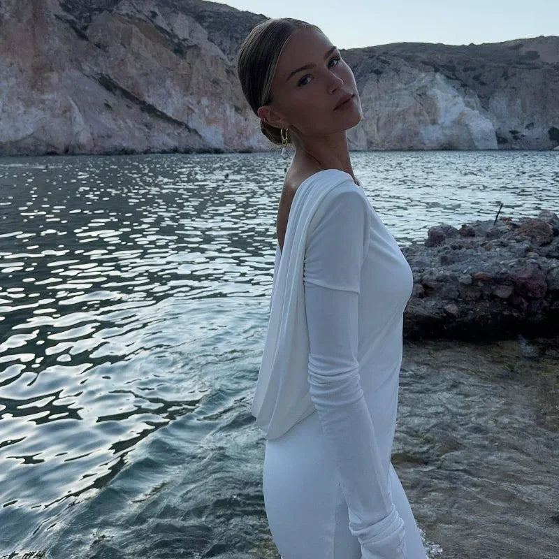 Introducing the Amy Dress. With its high-grade double-layered jersey fabric, this dress is expertly draped to create a stunning silhouette. The subtle design conceals and reveals in all the right places, while the daring low back adds a touch of daring elegance. Elevate your style with Amy.