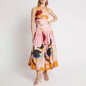 Introducing our Lulu Dress - the perfect way to make a statement at your next event. This maxi dress features trendy cut outs and a round neck, all in a stunning multicolor print. Get ready to turn heads and feel confident in our Lulu Dress.