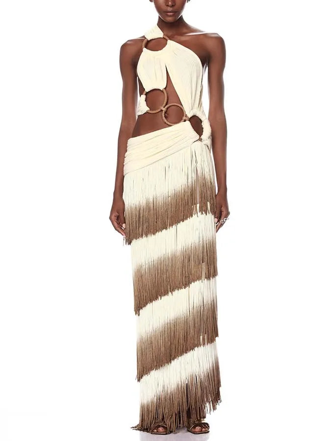 Feel confident and beautiful in the Lexie Gown! This stunning swimsuit features a tassel long skirt, perfect for your next vacation. The beautiful back design will have you turning heads and feeling like a goddess. Embody elegance and style with this must-have piece.