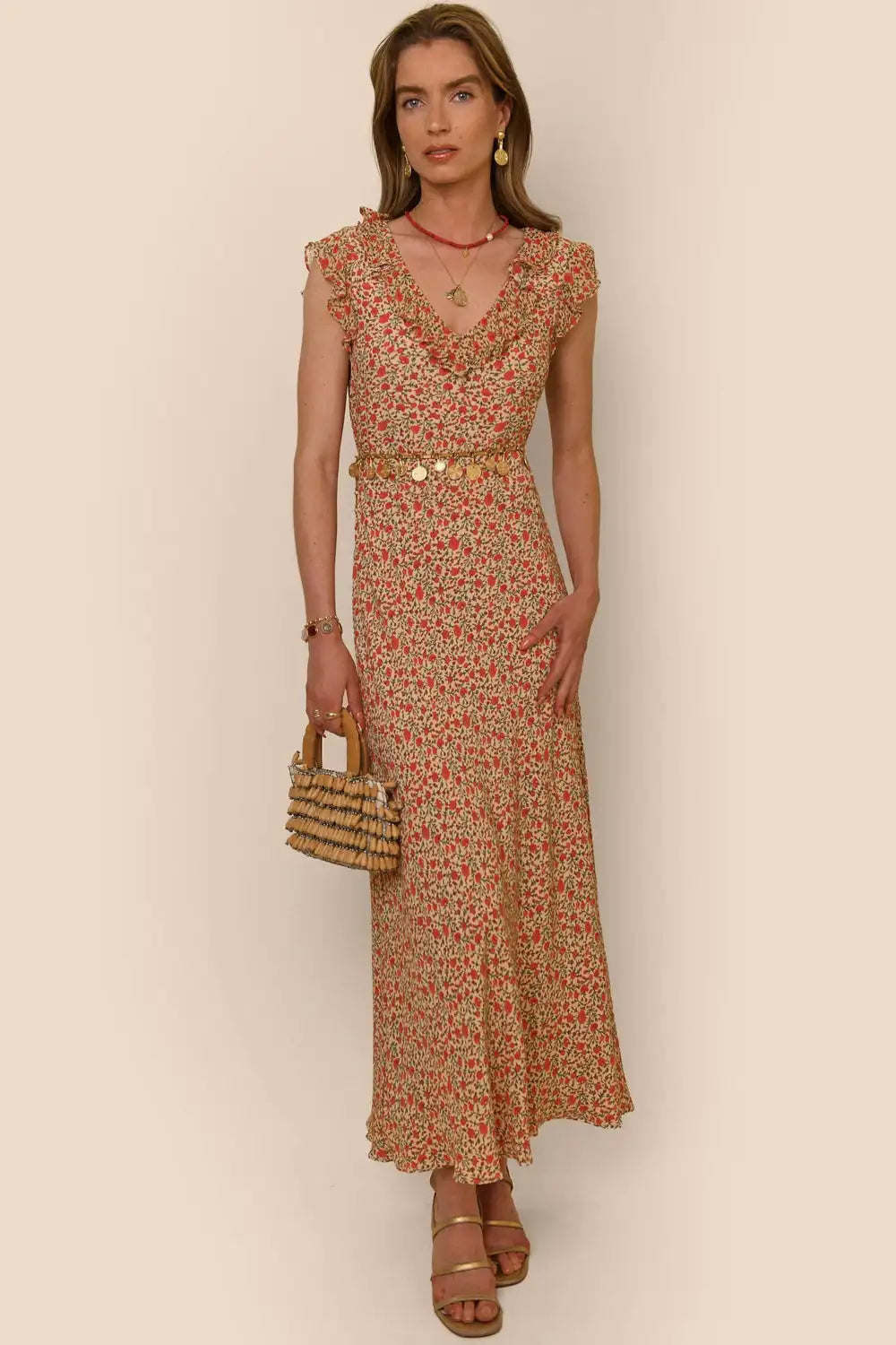 Indulge in the elegance of the Ditsy Cream Dress by RIXO. This high-quality, designer handmade dress features a ditsy cream print and a long, flowing skirt for a chic and sophisticated look. Every thread has been carefully crafted to ensure the utmost quality, making this dress a must-have for any fashion-forward individual.
