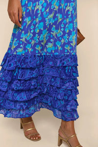 Indulge in the luxurious sophistication of the high-end designer Dress Blue Mari. Handmade with impeccable attention to detail, this long floral dress is perfect for any occasion. From casual shopping trips to elegant banquets, you'll look and feel stunning in the blue floral design. Elevate your wardrobe with this must-have piece.