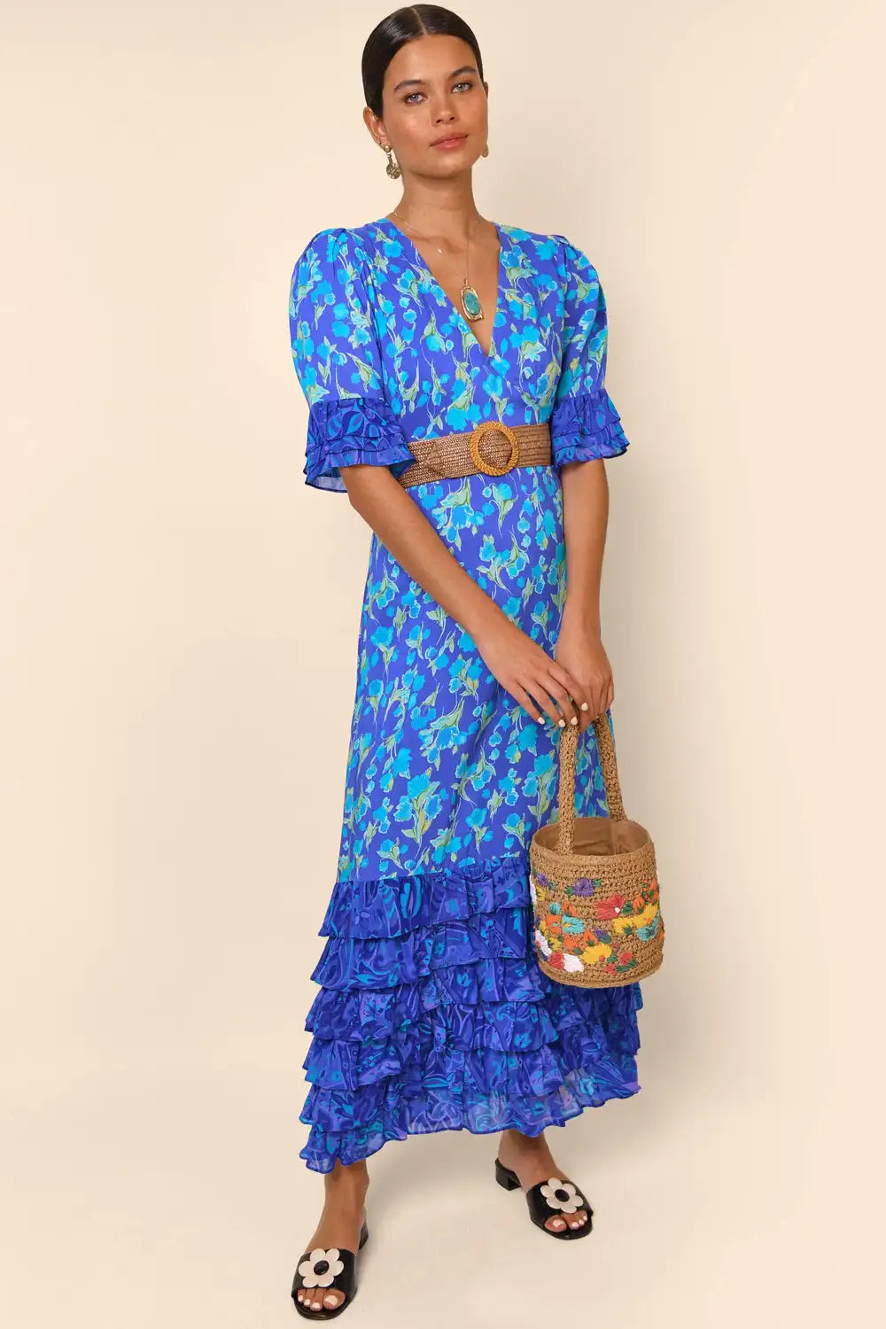 Indulge in the luxurious sophistication of the high-end designer Dress Blue Mari. Handmade with impeccable attention to detail, this long floral dress is perfect for any occasion. From casual shopping trips to elegant banquets, you'll look and feel stunning in the blue floral design. Elevate your wardrobe with this must-have piece.