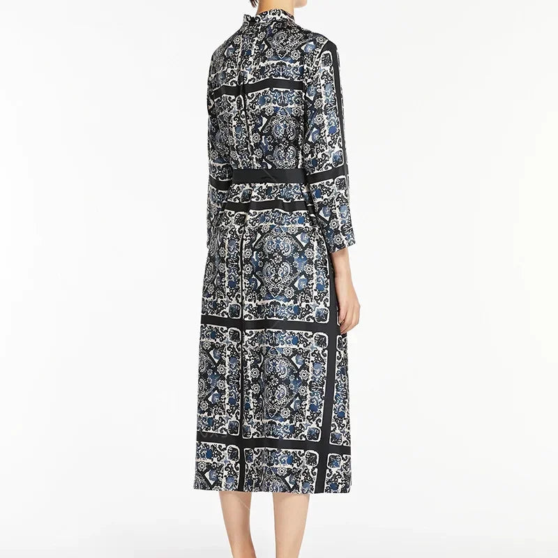 Elevate your style with the Max Mara Printed Silk Dress. The caftan-style dress is crafted from exquisite, printed silk that gives it a beautiful flow. With its slightly flared silhouette, mandarin collar, and matching belt, this dress accentuates your waist for a flattering look. Finished with hidden mother-of-pearl buttons and a back pleat for added elegance.