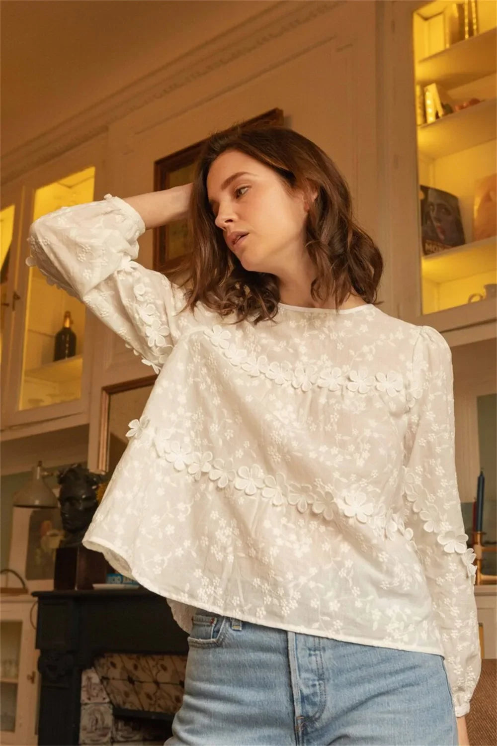 The Blouse Jenna is designed with a loose fit and intricate 3D floral embroidery for a unique and stylish look. The crisp white color adds a touch of elegance to any outfit. Upgrade your wardrobe with this must-have piece!