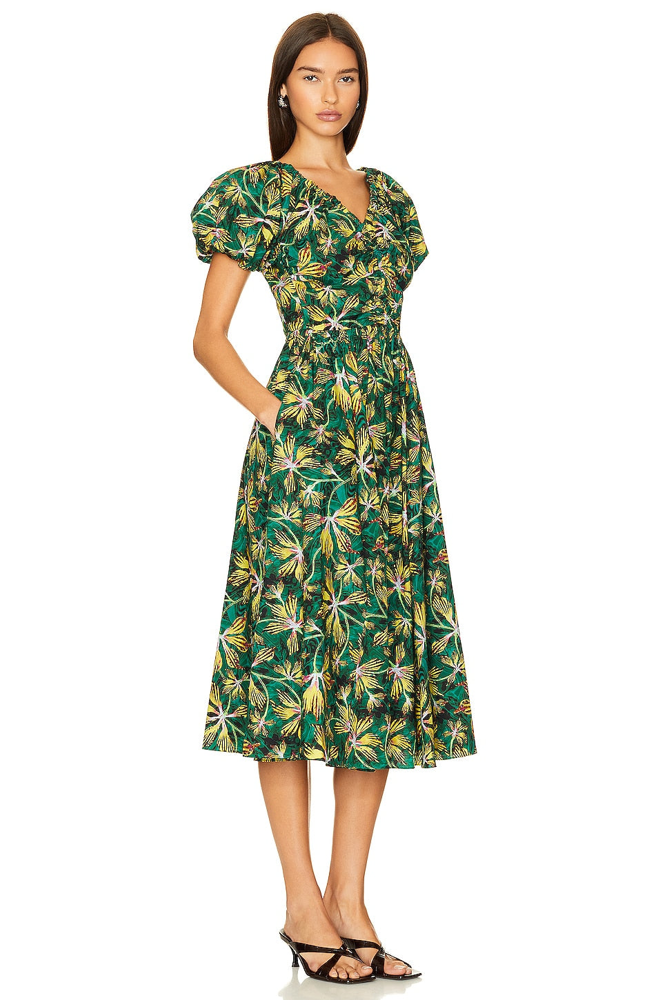 Indulge in the timeless elegance of our Cleobella Dress. This stunning midi dress features a chic floral design in a charming shade of green, radiating a romantic aura. Elevate your wardrobe with this luxurious piece, perfect for any occasion