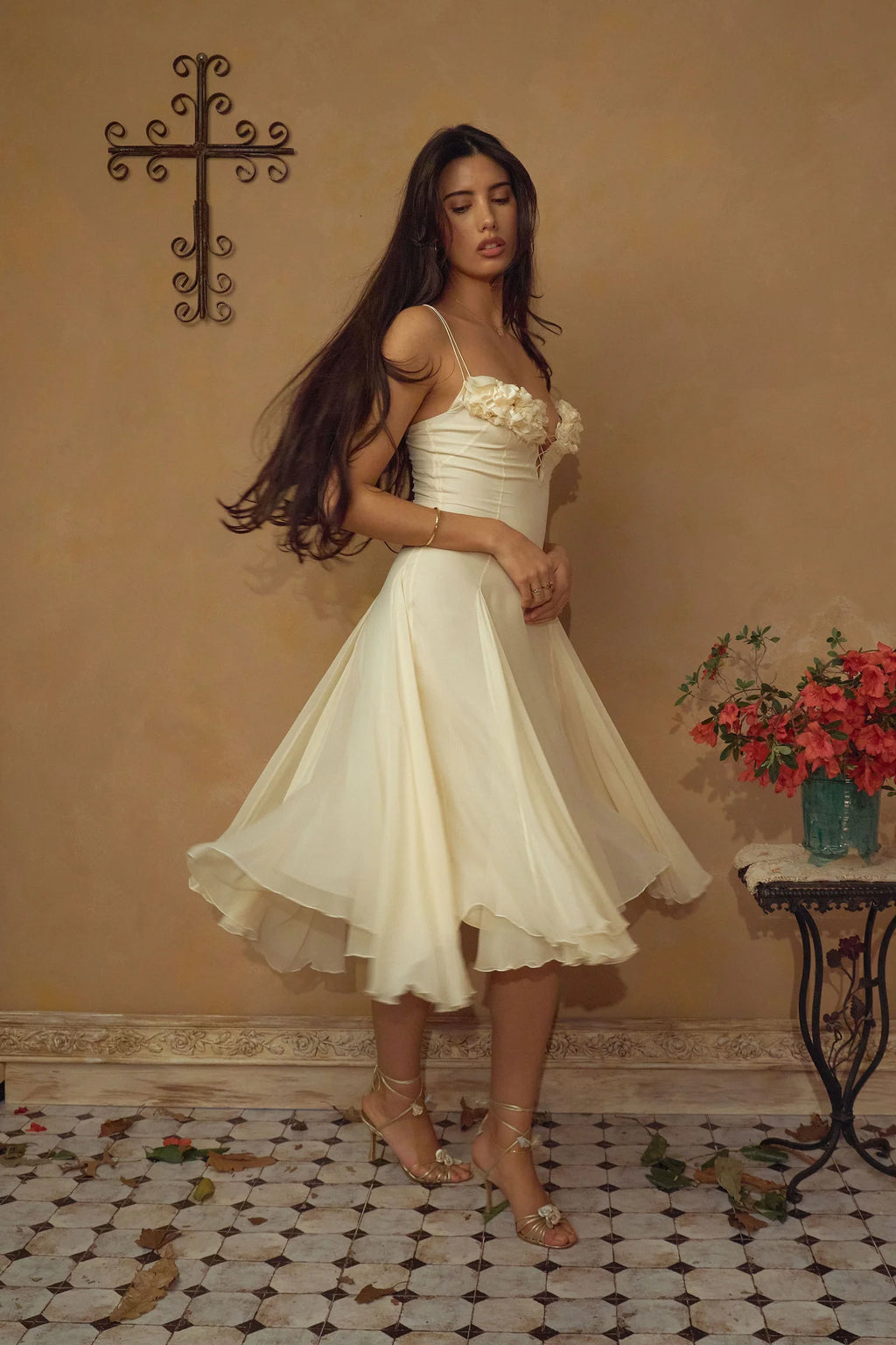 Crafted from delicate silk chiffon, the Valentina Dress in Butter features exquisite handcrafted floral appliqués precisely placed on the bust, creating a unique motif inspired by a weekly bouquet of roses. The 1/8-inch chiffon crisscross straps at the bust center add refined detail, while the dress includes a full separate lining, allowing for versatile styling options. A discreet center back zipper ensures a tailored fit, combining elegance with comfort for a sophisticated silhouette.