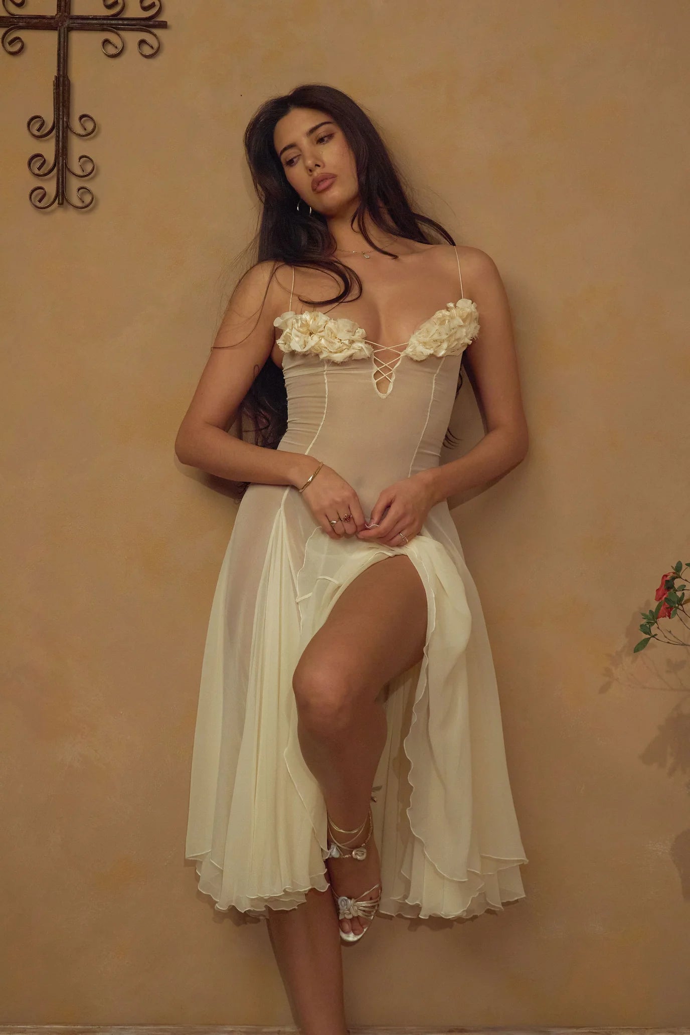 Crafted from delicate silk chiffon, the Valentina Dress in Butter features exquisite handcrafted floral appliqués precisely placed on the bust, creating a unique motif inspired by a weekly bouquet of roses. The 1/8-inch chiffon crisscross straps at the bust center add refined detail, while the dress includes a full separate lining, allowing for versatile styling options. A discreet center back zipper ensures a tailored fit, combining elegance with comfort for a sophisticated silhouette.