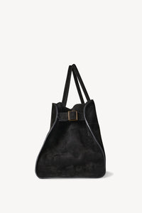 Discover the ultimate in luxurious and everyday style with The Row's Soft Margaux 17 suede tote. Expertly crafted in Italy from supple mocha brown suede, this bag features two rolled top handles, gusseted sides, and a spacious canvas lining. Upgrade your wardrobe with this effortlessly chic and versatile bag.