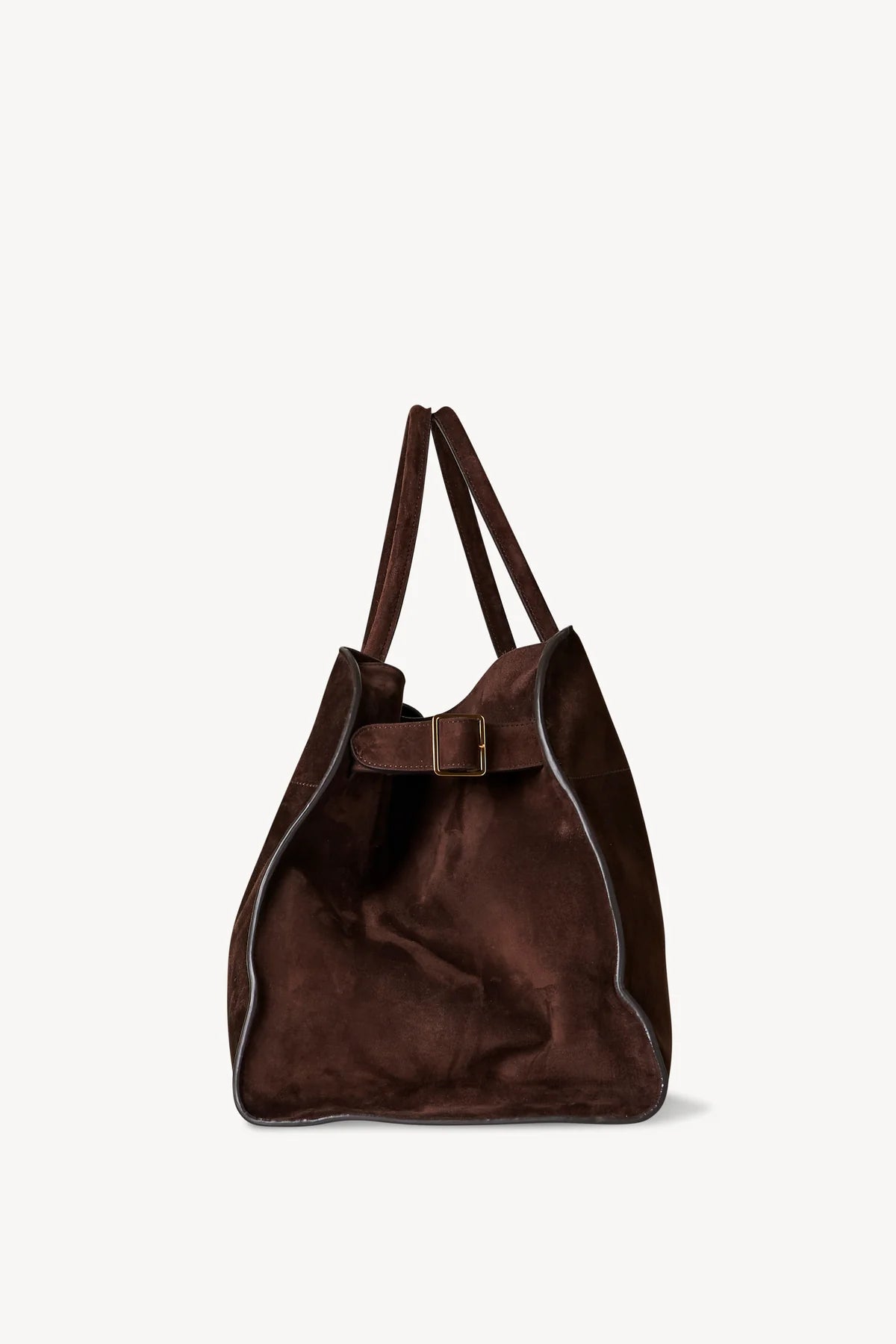 Discover the ultimate in luxurious and everyday style with The Row's Soft Margaux 17 suede tote. Expertly crafted in Italy from supple mocha brown suede, this bag features two rolled top handles, gusseted sides, and a spacious canvas lining. Upgrade your wardrobe with this effortlessly chic and versatile bag.