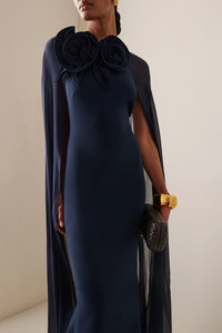 The silk blend long dress by Elie Saab features a non-detachable sheer cape that adds an elegant touch to your look. The beautiful flower appliqués at the neckline give this dress a unique and feminine vibe, perfect for that special occasion. Made of a high-quality silk in a flattering navy color, this dress is available in a range of sizes to suit every body type.