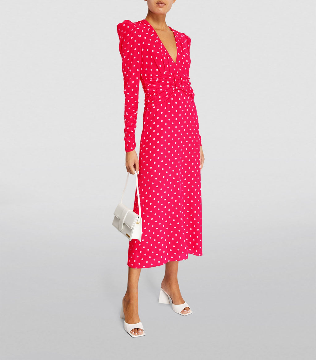 Expertly crafted from high-quality silk, the Alessandra Rich Polka-Dot Midi Dress features a stunning red dot pattern and a flattering V-neck design. Perfect for any occasion, this long dress exudes elegance and sophistication. Elevate your wardrobe with this timeless piece.