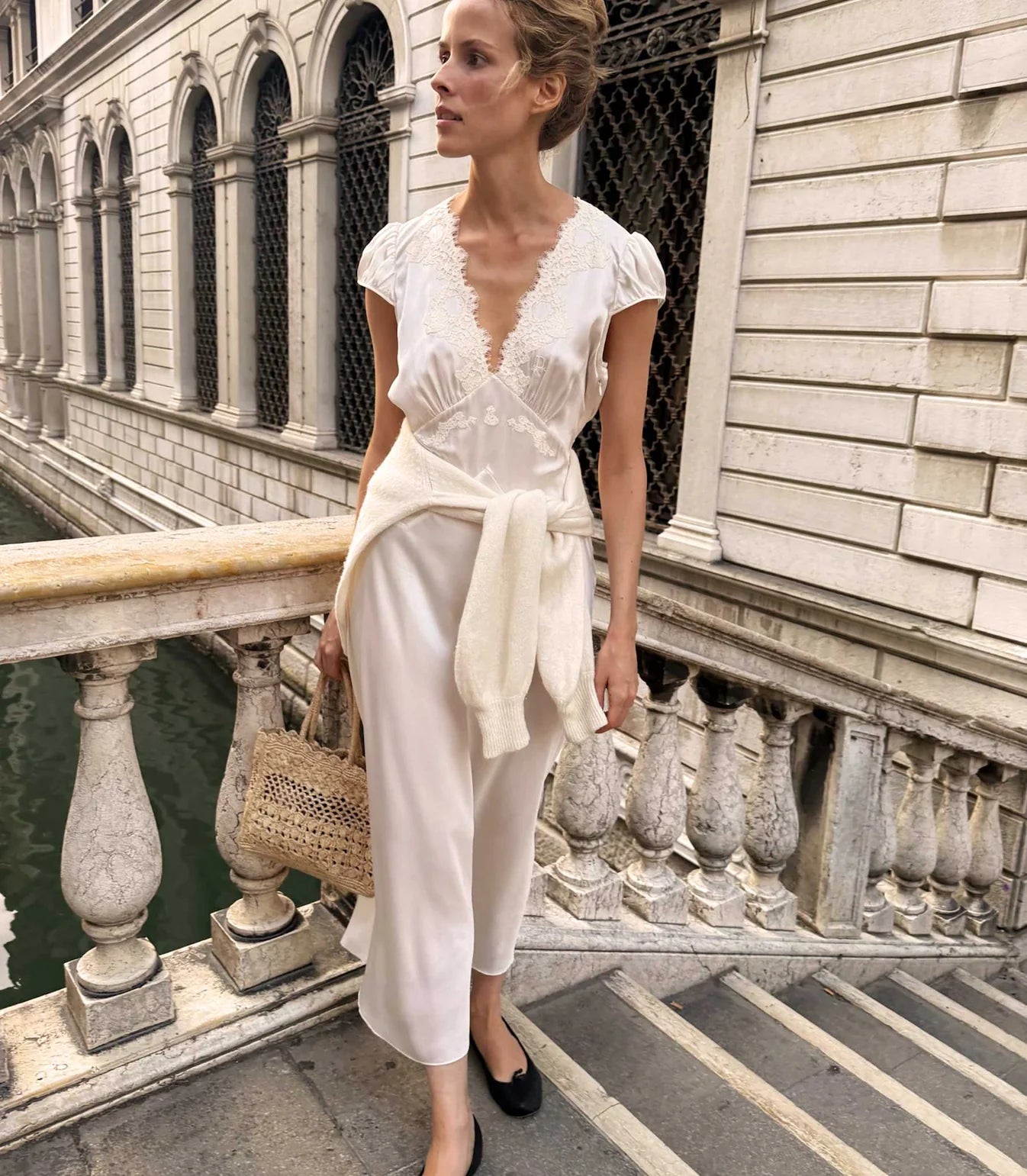 Slip into timeless elegance with the Coraline Dress by Doen, a 1930s-inspired masterpiece crafted from luxurious buttery silk satin. Gathered cap sleeves and a daring plunging V-neckline frame your silhouette, while intricate embroidered scallop lace adds vintage glamour. The fitted bodice features an invisible side seam zipper for seamless styling, paired with an adjustable back waist tie for a personalized fit. 