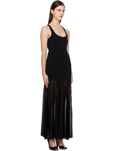Elevate your evening style with this Black Evening Tank Maxi Dress by Toteme, crafted from a stretchy viscose-blend jersey combined with open-knit viscose for a flattering fit and breathable comfort. Its paneled construction and pleated skirt create graceful movement, while the rib-knit scoop neck and arms add subtle texture. Fixed shoulder straps ensure a secure fit, making this dress an elegant choice for any occasion where sophistication meets ease.