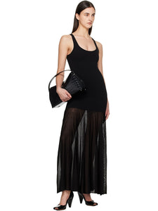 Elevate your evening style with this Black Evening Tank Maxi Dress by Toteme, crafted from a stretchy viscose-blend jersey combined with open-knit viscose for a flattering fit and breathable comfort. Its paneled construction and pleated skirt create graceful movement, while the rib-knit scoop neck and arms add subtle texture. Fixed shoulder straps ensure a secure fit, making this dress an elegant choice for any occasion where sophistication meets ease.