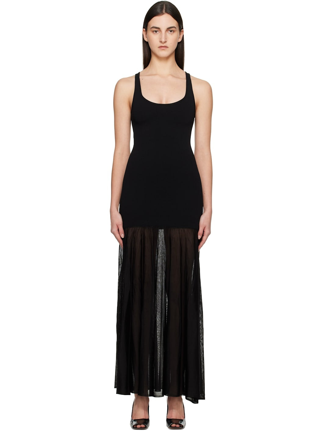 Elevate your evening style with this Black Evening Tank Maxi Dress by Toteme, crafted from a stretchy viscose-blend jersey combined with open-knit viscose for a flattering fit and breathable comfort. Its paneled construction and pleated skirt create graceful movement, while the rib-knit scoop neck and arms add subtle texture. Fixed shoulder straps ensure a secure fit, making this dress an elegant choice for any occasion where sophistication meets ease.