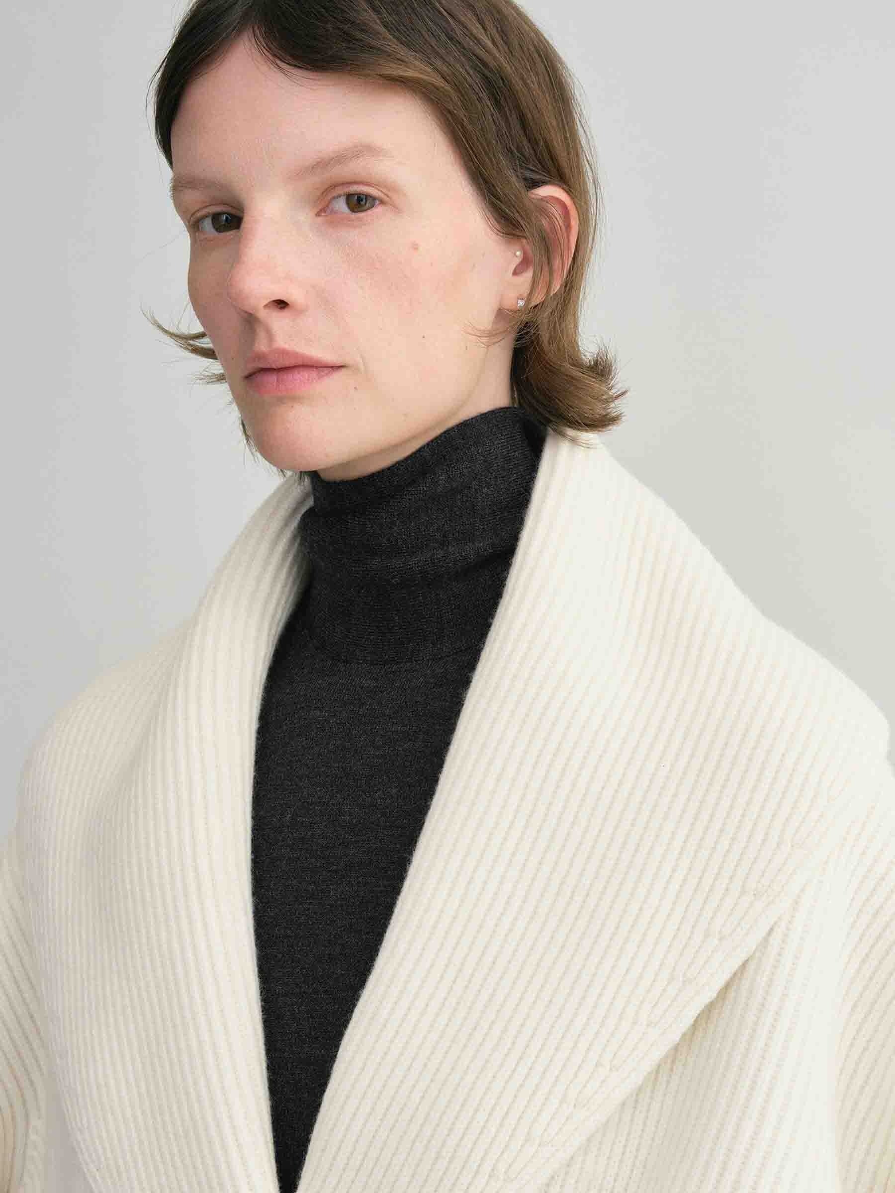 Elevate your layering with this oversized shawl-lapel cardigan by Toteme. Crafted from soft ribbed wool, it offers warmth and cozy comfort while its wide armholes and sleeves ensure effortless movement. The crossed front with button fastening adds a stylish, secure fit, and the curved shawl lapels bring a sophisticated touch to any outfit. Perfect for chic, relaxed days or cozy evenings indoors.
