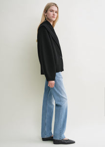 Elevate your layering with this oversized shawl-lapel cardigan in black by Toteme. Crafted from soft ribbed wool, it offers warmth and cozy comfort while its wide armholes and sleeves ensure effortless movement. The crossed front with button fastening adds a stylish, secure fit, and the curved shawl lapels bring a sophisticated touch to any outfit. Perfect for chic, relaxed days or cozy evenings indoors.
