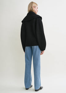 Elevate your layering with this oversized shawl-lapel cardigan in black by Toteme. Crafted from soft ribbed wool, it offers warmth and cozy comfort while its wide armholes and sleeves ensure effortless movement. The crossed front with button fastening adds a stylish, secure fit, and the curved shawl lapels bring a sophisticated touch to any outfit. Perfect for chic, relaxed days or cozy evenings indoors.