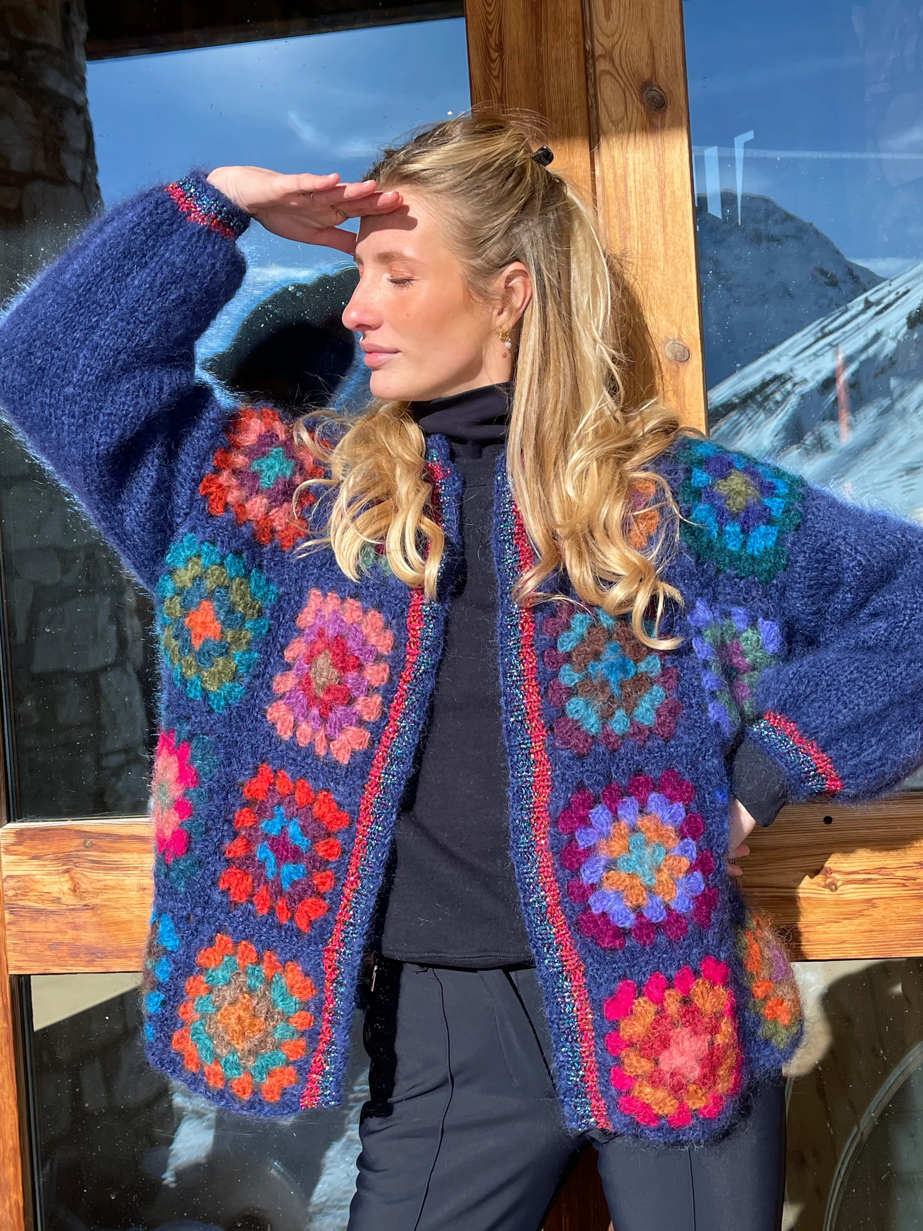 Get cozy in the Cardigan Color Block Blue, showcasing unique charm and remarkable craftsmanship. Each piece is hand-made by our skilled knitters, resulting in slight variations that make it truly one-of-a-kind. Embrace its individuality and add a touch of warmth and style to your wardrobe.