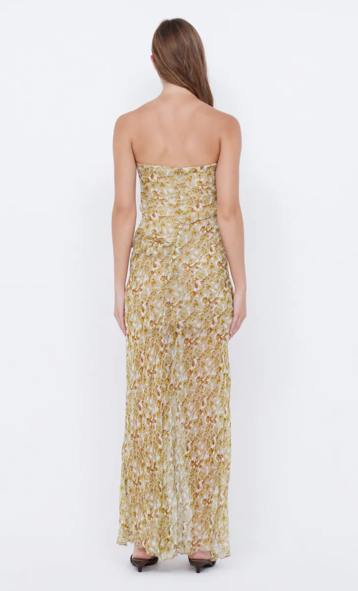 Elevate your style with the Opal Strapless Maxi Dress from bec + bridge. The lightweight, lustrous print fabric effortlessly drapes over your body, while the front leg split and asymmetrical raw cut ruffle detailing add a touch of sophistication. With a chic hanky drape hemline and versatile strapless neckline, this dress is perfect for any occasion. Add it to your wardrobe for an exclusive and timeless look.