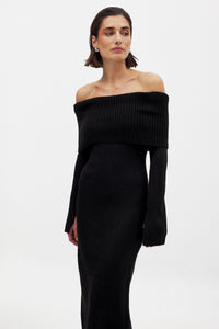 This knitted midi dress offers a perfect balance of comfort and sophistication. Crafted from stretchy knit fabric, it ensures ease of movement with a relaxed fit. The folded off-shoulder neckline adds an elegant flair, complemented by long sleeves featuring subtle slit details for a refined, contemporary look. Ideal for sophisticated casual occasions, this dress delivers effortless style without compromising on wearability.