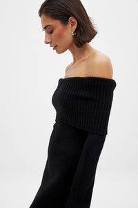 This knitted midi dress offers a perfect balance of comfort and sophistication. Crafted from stretchy knit fabric, it ensures ease of movement with a relaxed fit. The folded off-shoulder neckline adds an elegant flair, complemented by long sleeves featuring subtle slit details for a refined, contemporary look. Ideal for sophisticated casual occasions, this dress delivers effortless style without compromising on wearability.