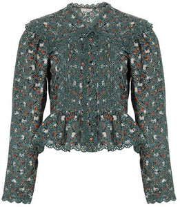 Get ready to turn heads with the Mina Blouse! This gorgeous floral-printed blouse features long, airy sleeves, a stunning large collar, and delicate frilled edges. Perfect for making a statement and adding a touch of romantic flair to any outfit.