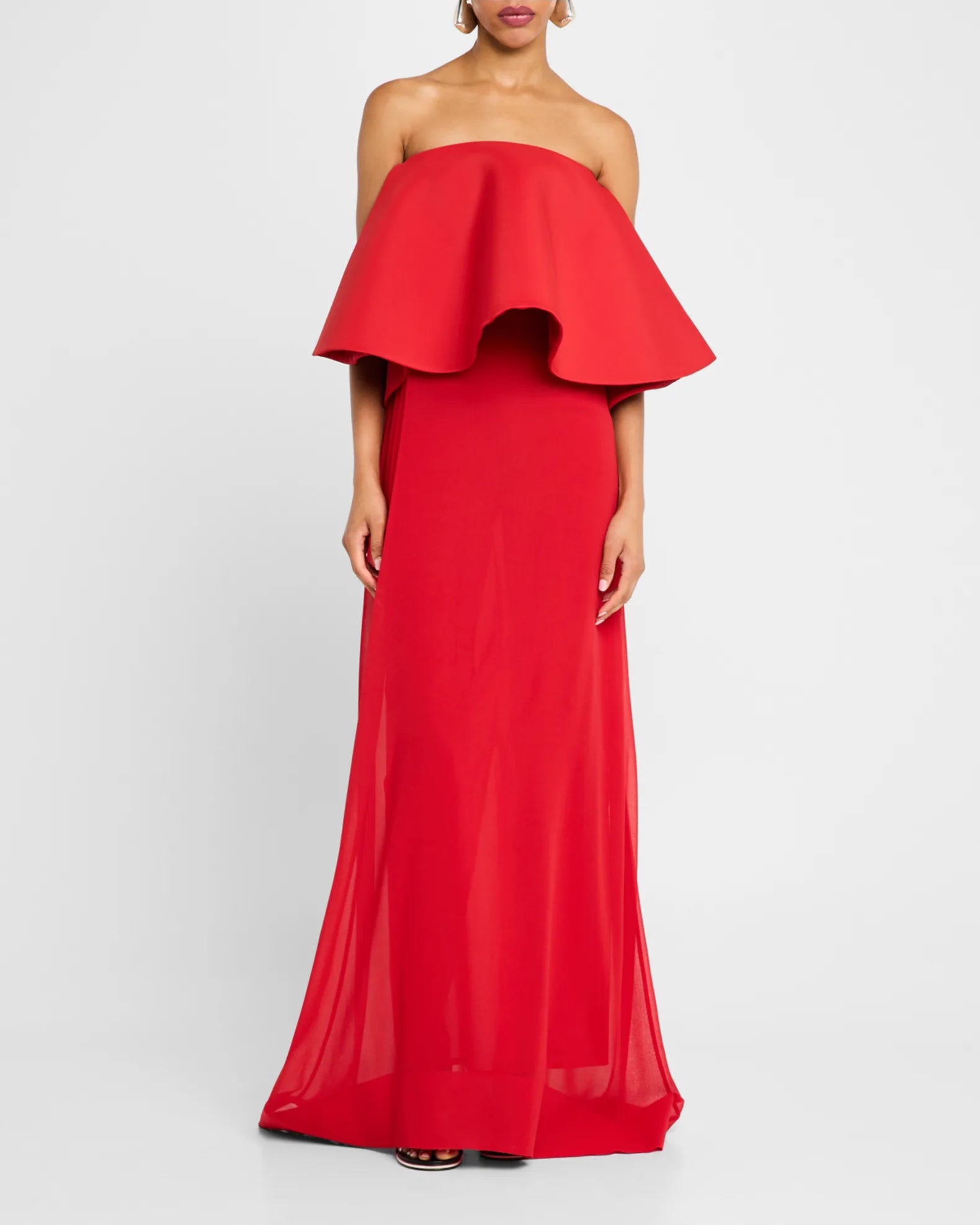 Elevate your style with the Vela Long Sheer Strapless Dress by Jacquemus. This elegant piece combines sheer and opaque knit for a sophisticated look, featuring a strapless neckline and sleeveless design that highlights your shoulders. The straight silhouette gracefully skims the body, while the adjustable back strap ensures a perfect fit. Finished with a floor-pooling hem and discreet back zip, this dress promises effortless glamour for any occasion.