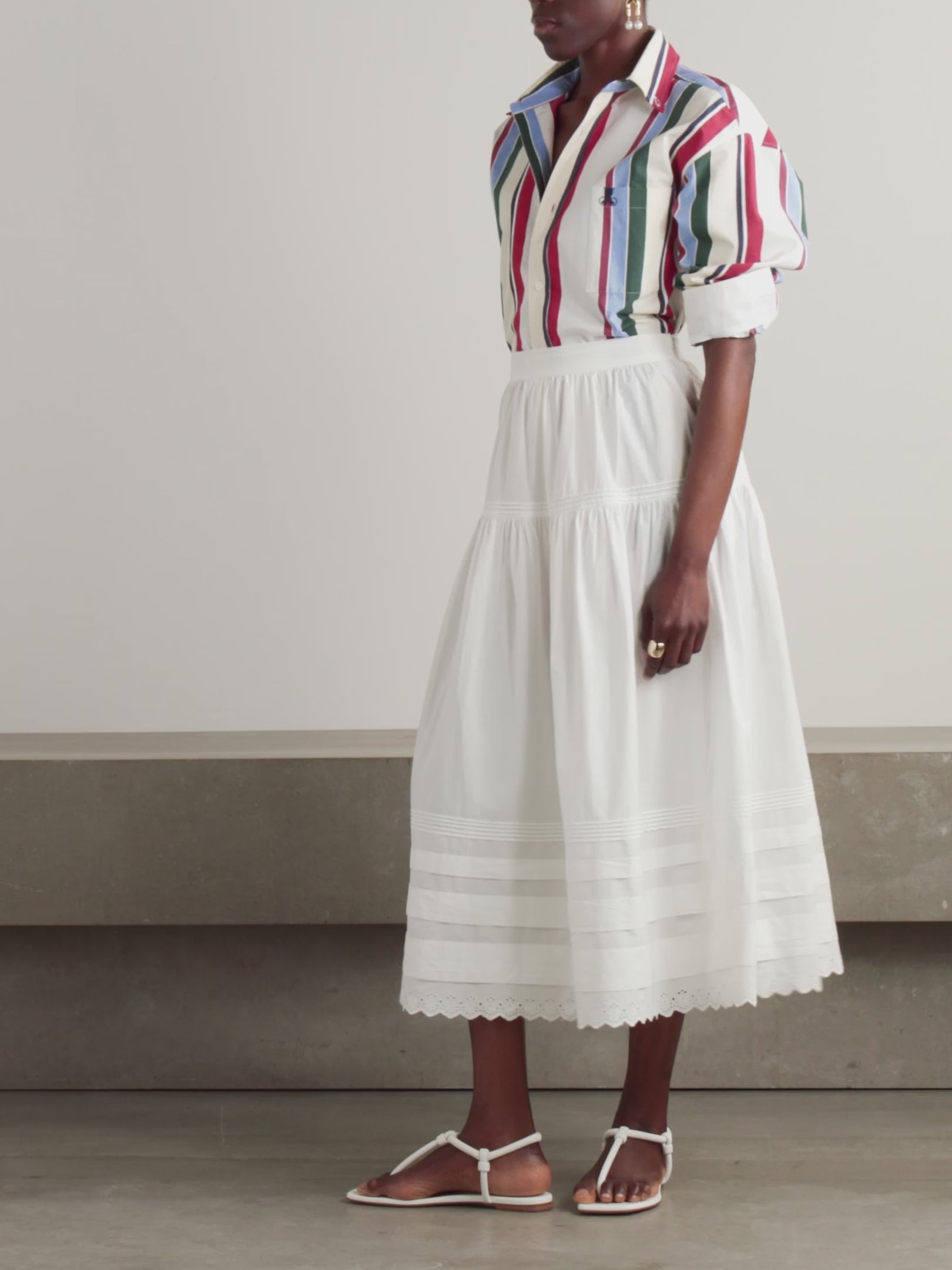 Inspired by Edwardian bridal tradition, this Sebastiane skirt combines timeless elegance with modern sustainability. Crafted from organic cotton-poplin, its tiered silhouette features delicate pintucks and elegant broderie anglaise trim, adding a touch of vintage charm to your wardrobe. Perfect for those who appreciate refined detail and eco-conscious fashion.