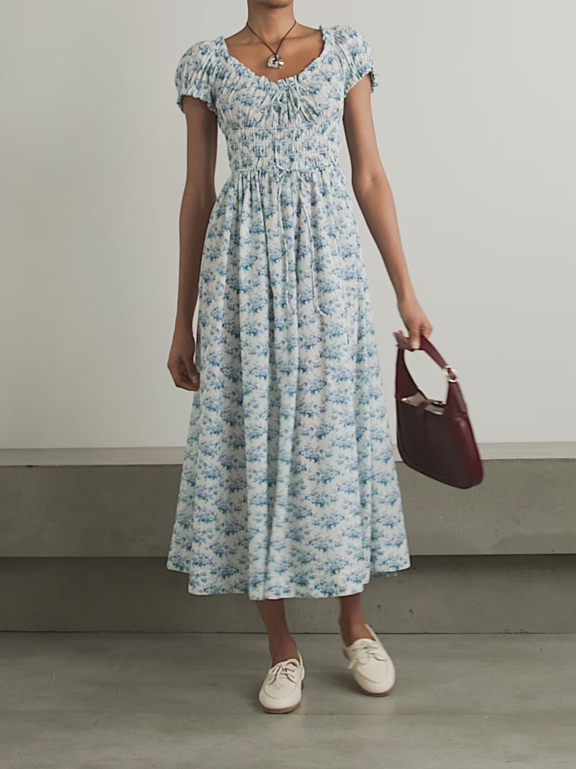 Experience effortless romance with the Ashlynn midi dress by DÔEN. Crafted from breathable organic cotton-voile, its all-over floral print captures a timeless, delicate charm. The shirred bodice offers a comfortable fit, while adjustable ties at the neckline and waist allow you to tailor the silhouette to your liking. Perfect for warm days and graceful evenings, this dress brings Southern Californian ease to your wardrobe with eco-friendly elegance.