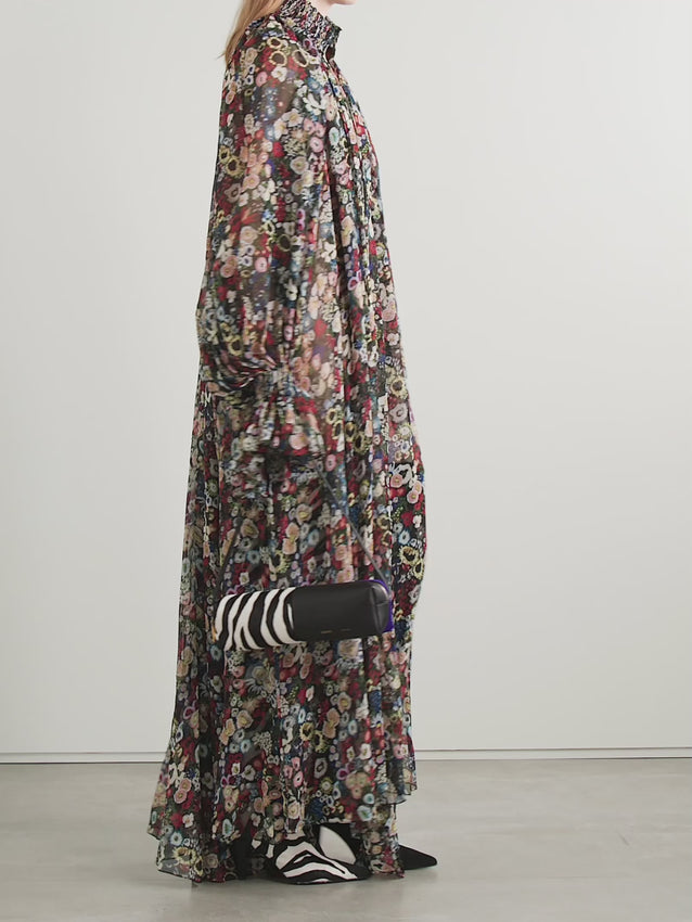 Discover timeless elegance with the KHAITE Edgar maxi dress, a masterpiece in silk-chiffon featuring an enchanting floral design. The refined turtleneck paired with graceful pleating creates a striking silhouette that flatters and elongates. Ideal for both momentous celebrations and sophisticated everyday styling, this piece drapes beautifully with the luxurious ease only premium fabrics can deliver.