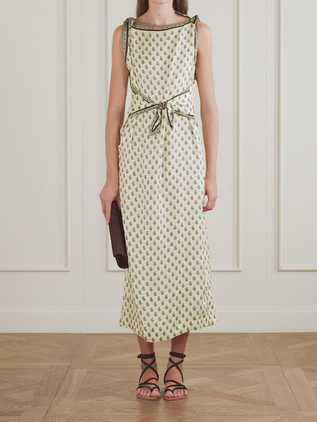 Embrace nostalgic elegance with the Amorette midi dress, a DÔEN signature piece that captures the romance of 19th-century French Provençal design. Crafted from fluid silk-blend twill, this dress features the iconic Taormina paisley print—a timeless pattern that whispers vintage charm with modern sensibility. The considered silhouette is softly structured for effortless grace, while adjustable shoulder and waist ties let you customize the fit to your frame. 