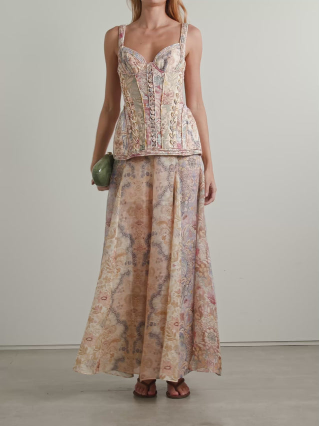 Discover the artistry of Zimmermann's Rebellion Printed Linen Maxi Dress, where sophisticated design meets effortless elegance. This stunning piece masterfully blends a structured, corset-inspired bodice with a flowing maxi skirt, creating the coveted separates look in one seamless silhouette. Crafted from breathable linen, it features a captivating vintage-inspired print that commands attention while maintaining timeless appeal. 
